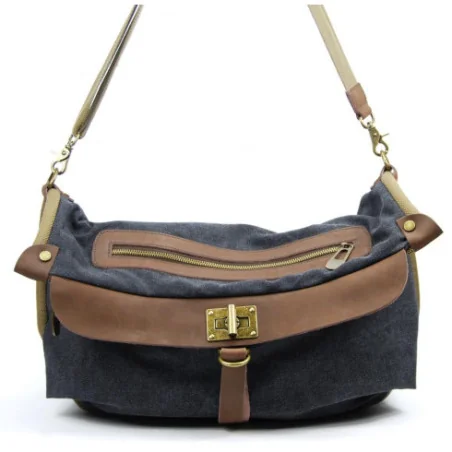 Sac mode femme en cuir et toile porté épaule avec bandoulière noir sac week-end tendance